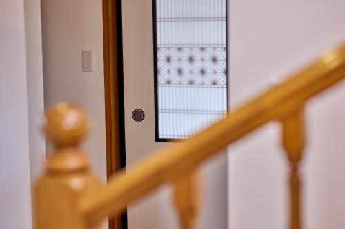 a close up of a door with a window at Fuji Holiday in Fujiyoshida