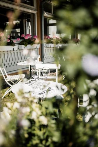 a table with wine glasses on top of it at Grand Hotel Marstrand in Marstrand