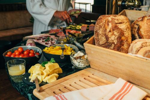 a table topped with lots of different types of food at Grand Hotel Marstrand in Marstrand