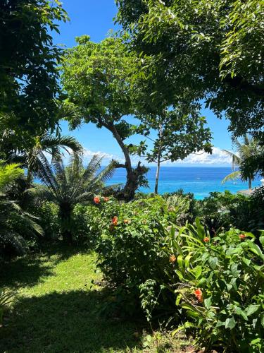 a view of the ocean from a garden at Argonauta Boracay Apartment Suites and Villas in Boracay