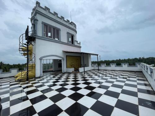 a building with a checkered floor on a roof at White palace airport transit Hotel in Katunayake
