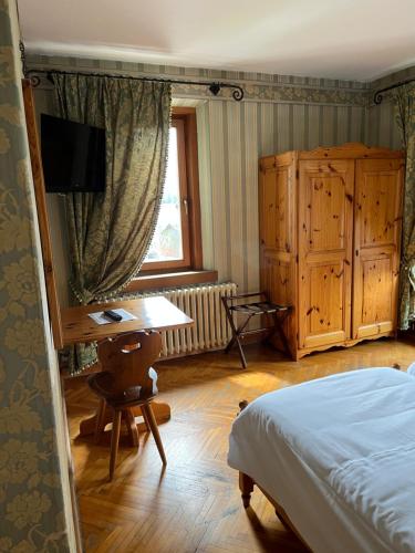 Postel nebo postele na pokoji v ubytování Hotel Albergo Dolomiti