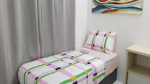 Postel nebo postele na pokoji v ubytování IFS Seri Iskandar by Glex