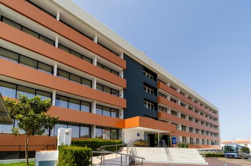 an exterior view of a building at Ohtels Carabela in Matalascañas