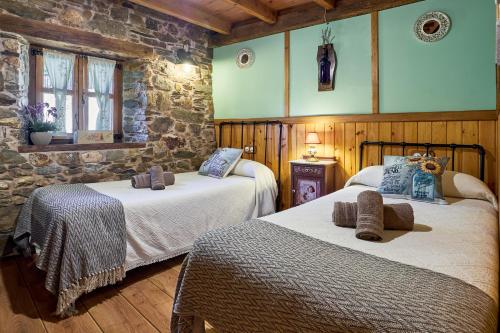 Ένα ή περισσότερα κρεβάτια σε δωμάτιο στο Casa Rural Cornatel