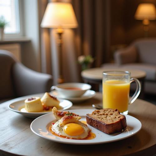 a table with eggs and bread and a glass of orange juice at Constellation XingSu Boutique Hotel in Huangshan