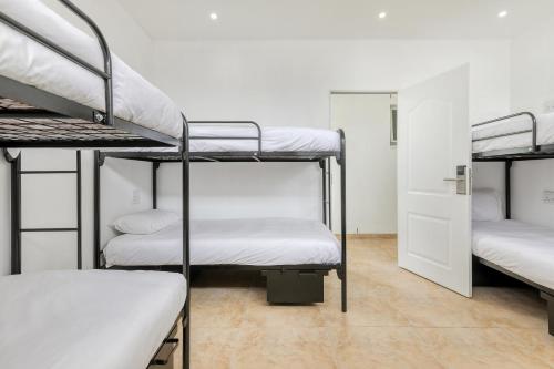 a group of bunk beds in a dorm room at Inn & Out Express Sea Point in Cape Town