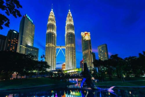 a view of the kuala lumpur city skyline at night at Ark Batu Caves Bussines Hotel in Batu Caves