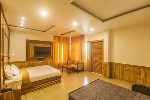 Кровать или кровати в номере WOW STAYZ2 Hotel The Lodge