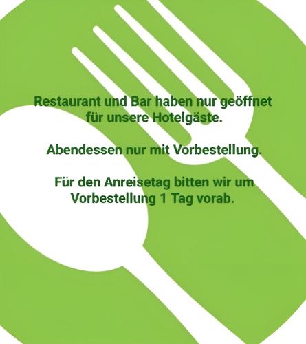 a green circle with a white speech bubble at Hotel Silbertanne in Hohegeiß