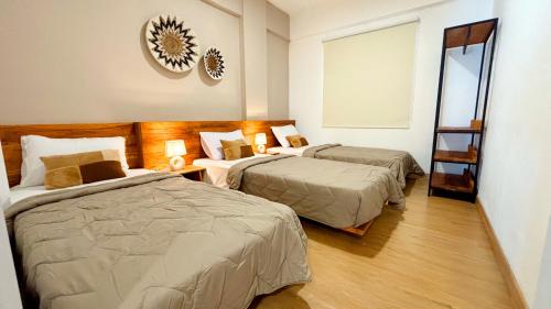 Postel nebo postele na pokoji v ubytování Ocean Beach Villas - Carita Kondominium