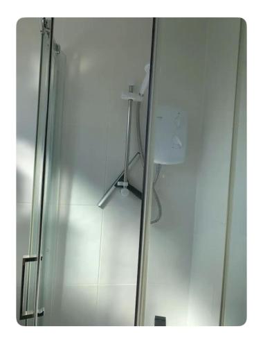 a shower in a bathroom with a glass door at 2 Bed Chalet Sleeps 6 - Pets Near Beach Parking in Mablethorpe