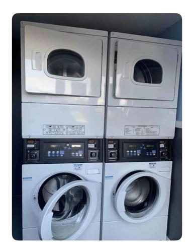 three washing machines are stacked next to each other at 2 Bed Chalet Sleeps 6 - Pets Near Beach Parking in Mablethorpe