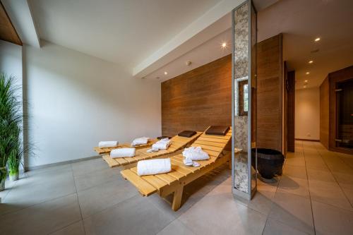 a room with a row of tables with towels at Hotel Piz St. Moritz in St. Moritz