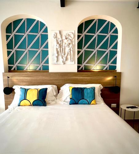 Ένα ή περισσότερα κρεβάτια σε δωμάτιο στο Boutique Hotel Palazzo Donna Iulia