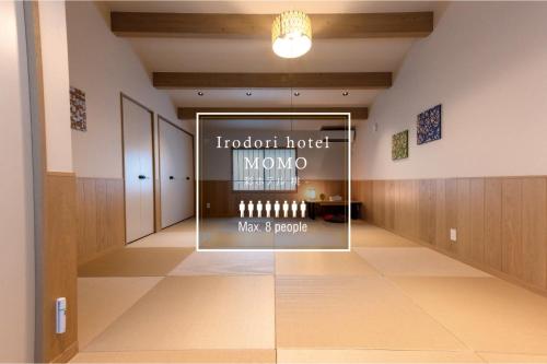 a room with a window with a display of wine bottles at Irodori Hotel MOMO in Fukuoka