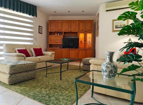 a living room with a couch and a table at Portomaso seaview in Sliema
