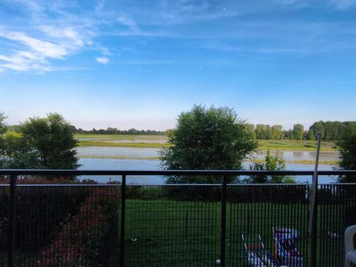 a view of a river from a fence at Camere Rozzano, vicino Humanitas in Rozzano