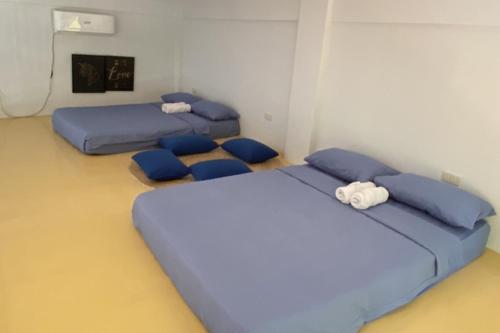 Ένα ή περισσότερα κρεβάτια σε δωμάτιο στο Casa Calungsod La Union