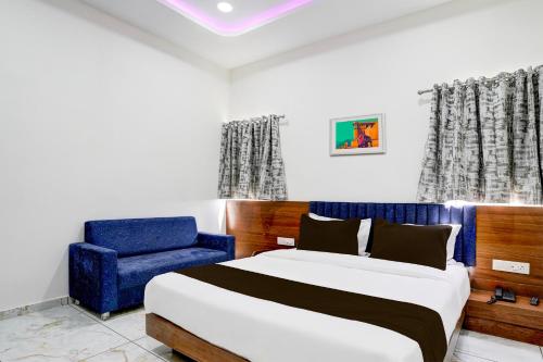 Postel nebo postele na pokoji v ubytování Hotel O Dabhoi Vadodara