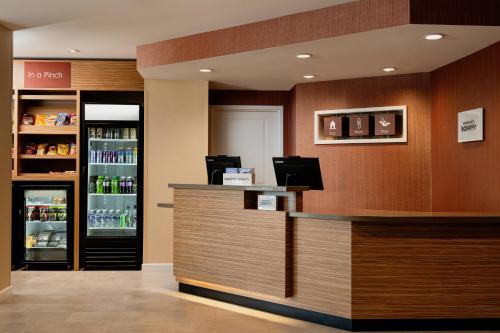 a bar in a restaurant with a drink cooler at TownePlace Suites by Marriott Memphis Olive Branch in Olive Branch