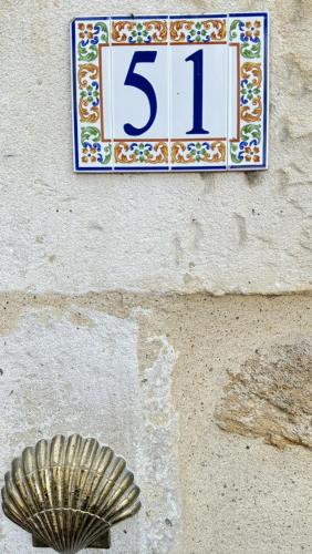 a sign on the side of a wall with aificantificantificantochondrosis at Hôtel de France et de Russie in Thiviers