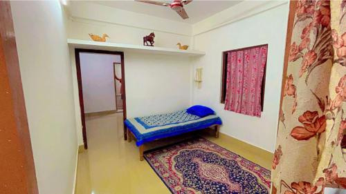 Ένα ή περισσότερα κρεβάτια σε δωμάτιο στο Kunkunpaati