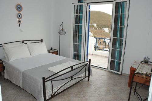 Ένα ή περισσότερα κρεβάτια σε δωμάτιο στο The Panorama House
