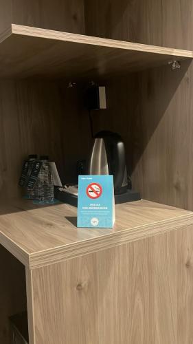 a blue box sitting on top of a wooden counter at WS Hotel in Tabuk