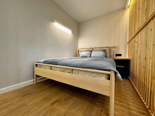 a bedroom with a large bed in a room at 2nd floor Casa Kungu Street in Liepāja