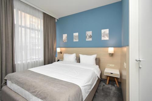 Postel nebo postele na pokoji v ubytování In City Hotel
