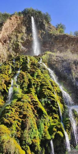 two waterfalls on the side of a hill with moss at Charmant appartement moderne au cœur de Gueliz, Marrakech Lumineux", Cosy", Bien situé in Marrakech