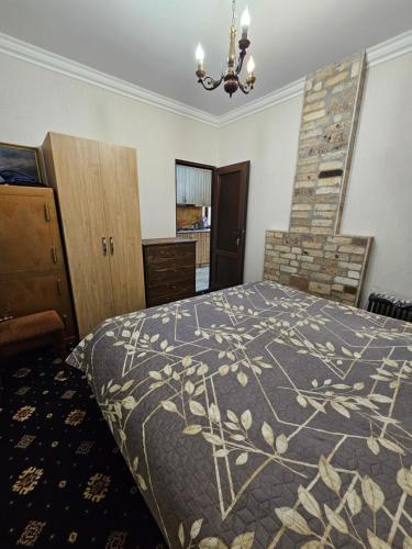 a bedroom with a bed and a fireplace at Fenix Villa in Zarritʼapʼ