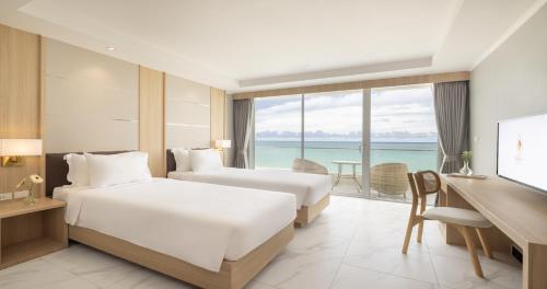 Postel nebo postele na pokoji v ubytování Eastin Resort Rayong