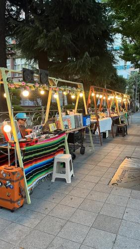 a market with a boat on display on a sidewalk at 부산 서면 레지던스 신축 힐링 하우스 in Busan
