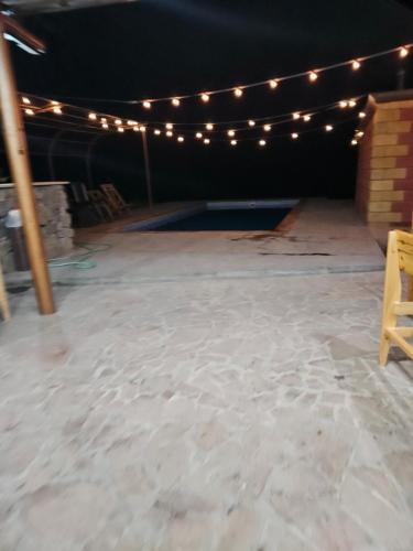 a room with a stage with lights on it at Fenix Villa in Zarritʼapʼ