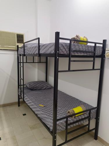 a couple of bunk beds in a room at AL SHAMS MUSCAT MALE hostel in Muscat