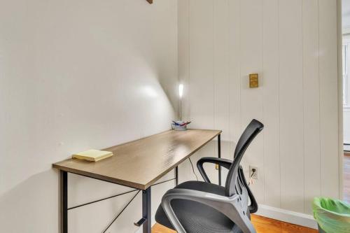 a desk and a chair in a room at Crested One Place in Manchester