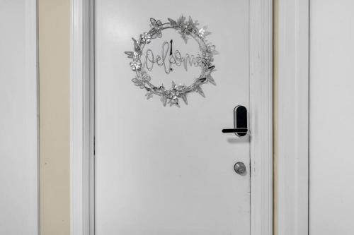 a door with a wreath on the front of it at Crested One Place in Manchester