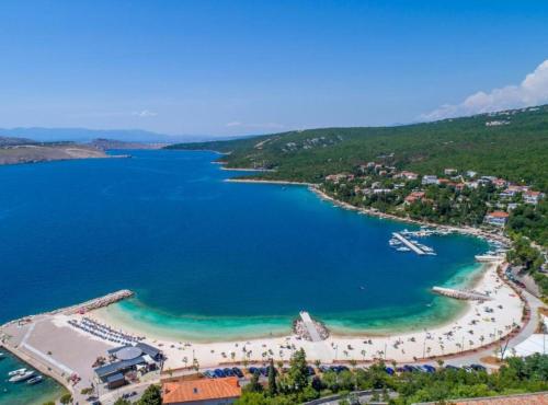 an aerial view of a beach with boats in the water at Villa Fran in Šmrika
