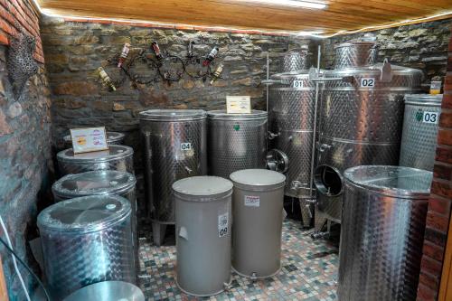 a room with a bunch of trash cans and drums at Maksimilijan Winery Apartments & wine tasting in Pepelište