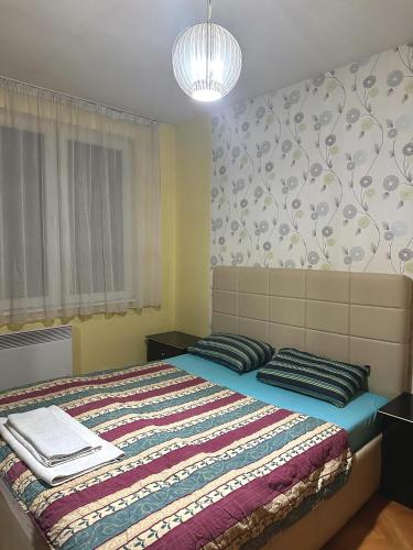 Postel nebo postele na pokoji v ubytování M apartment