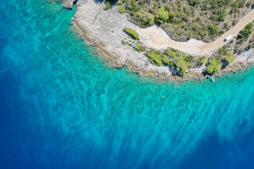 an aerial view of a beach and the ocean at Hvaretta Villas in Stari Grad