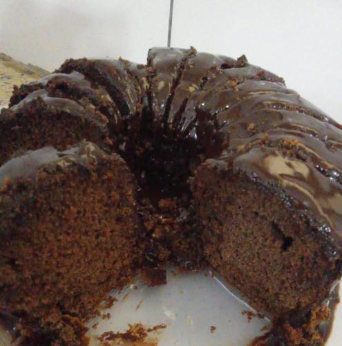 a chocolate cake sitting on top of a plate at Pousada Vila Pitanga in Santos