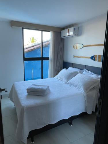 En eller flere senge i et værelse på Makadamia- Cantinho do mar Beira-mar em Porto de Galinhas