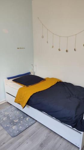 Una cama o camas en una habitación de Maison à l'aube des vignes