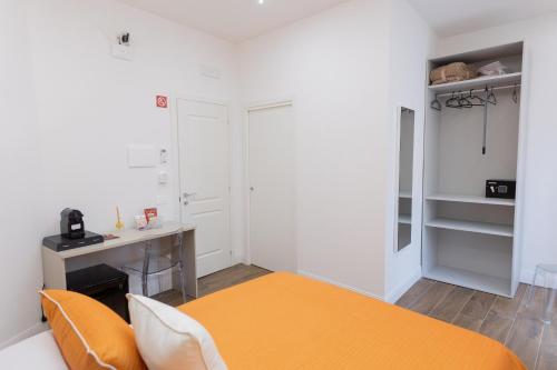 Postel nebo postele na pokoji v ubytování Iannò Napoli Rooms