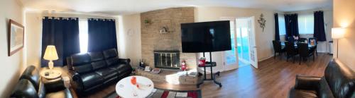 a living room with a couch and a fireplace at Gahanna Ranch-Tastic 3-bedroom recently renovated Aug 2024 in Gahanna