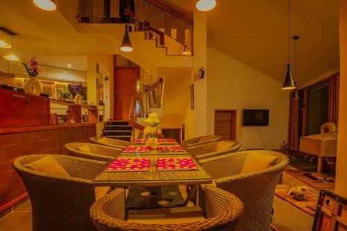 a dining room with a table and chairs at Revaant Retreat in Rāmgarh