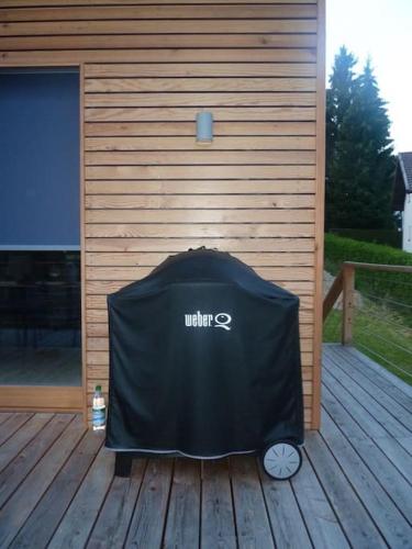 a black cover sitting on a wooden deck at WaldNur in Neureichenau